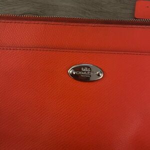 Coach Woman’s Vibrant Orange Leather wallet